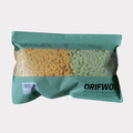 Green and orange hanging hand towels in DrifWoo packaging
