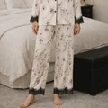 Detail view of the black lace trim and ink floral print on Ink Garden pajamas