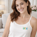 Woman wearing white modal built-in bra camisole with left-chest floral MOM graphic
