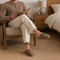 Lifestyle view of Brown faux suede house slippers in a relaxed home setting