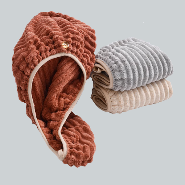 Brick red chenille hair towel cap open beside folded gray and beige caps
