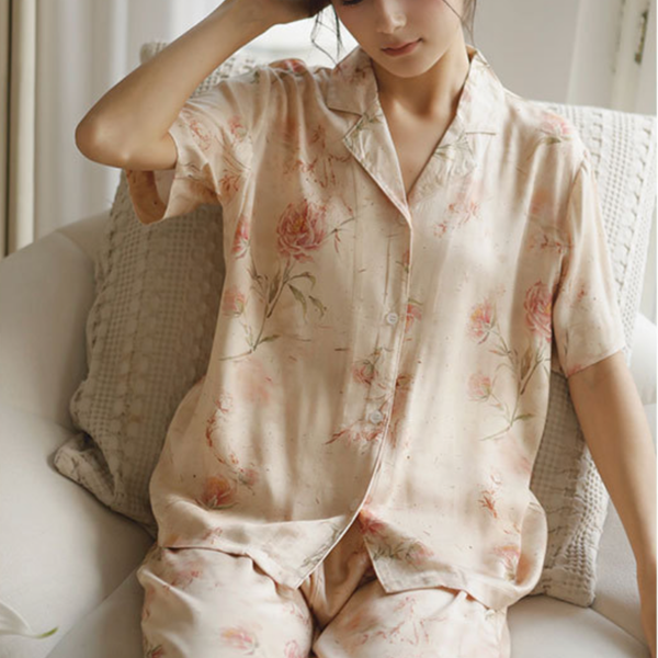 Woman wearing short sleeve rose print viscose pajama top