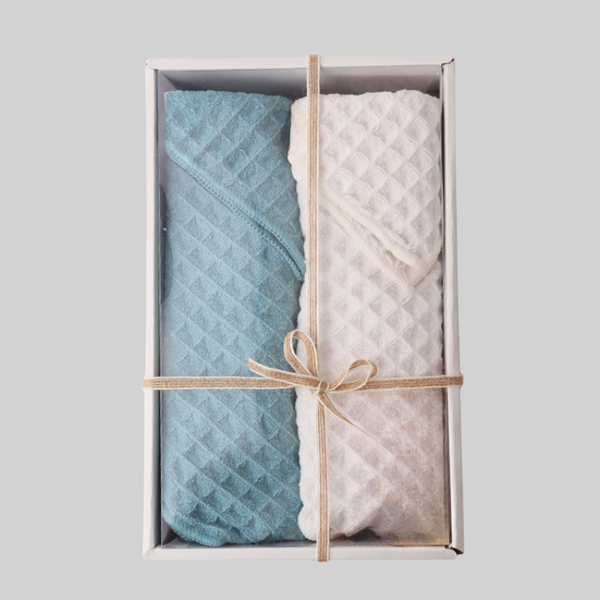 Blue and beige waffle-weave towel set in an open gift box