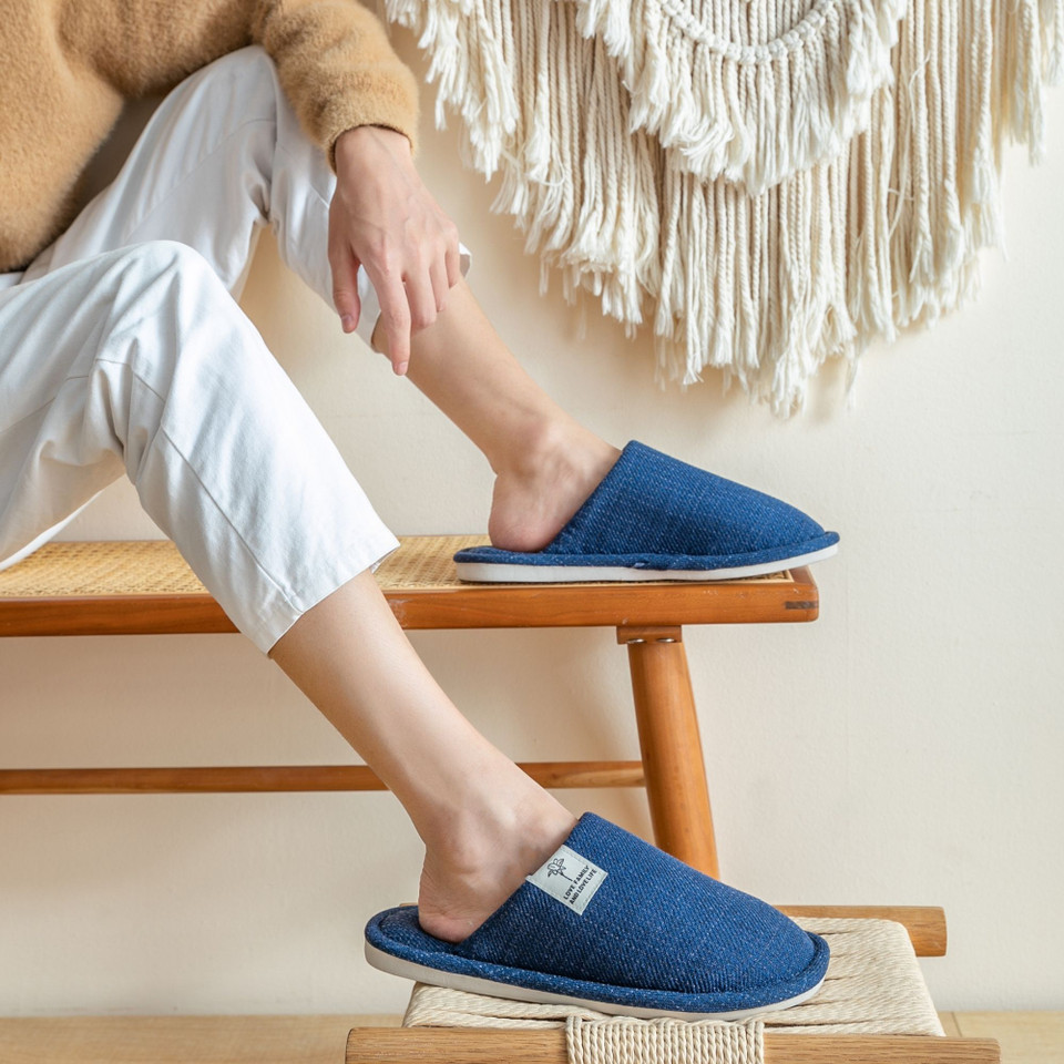 Men wearing textured closed-toe house slippers indoors