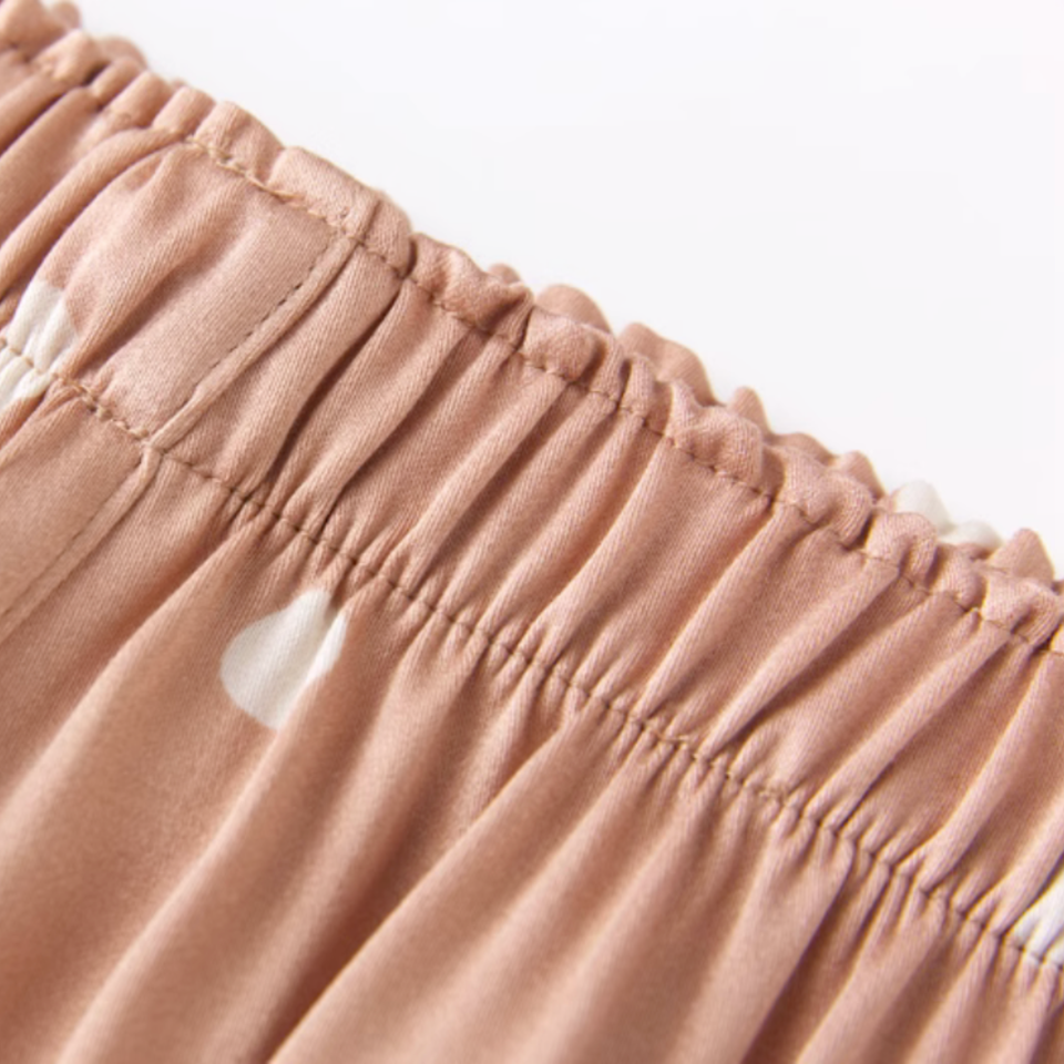 Wide elastic waistband on taupe polka dot pajama pants