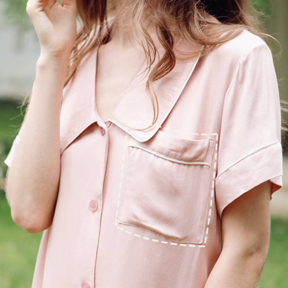 Woman wearing Tea Rose satin button front lounge dress
