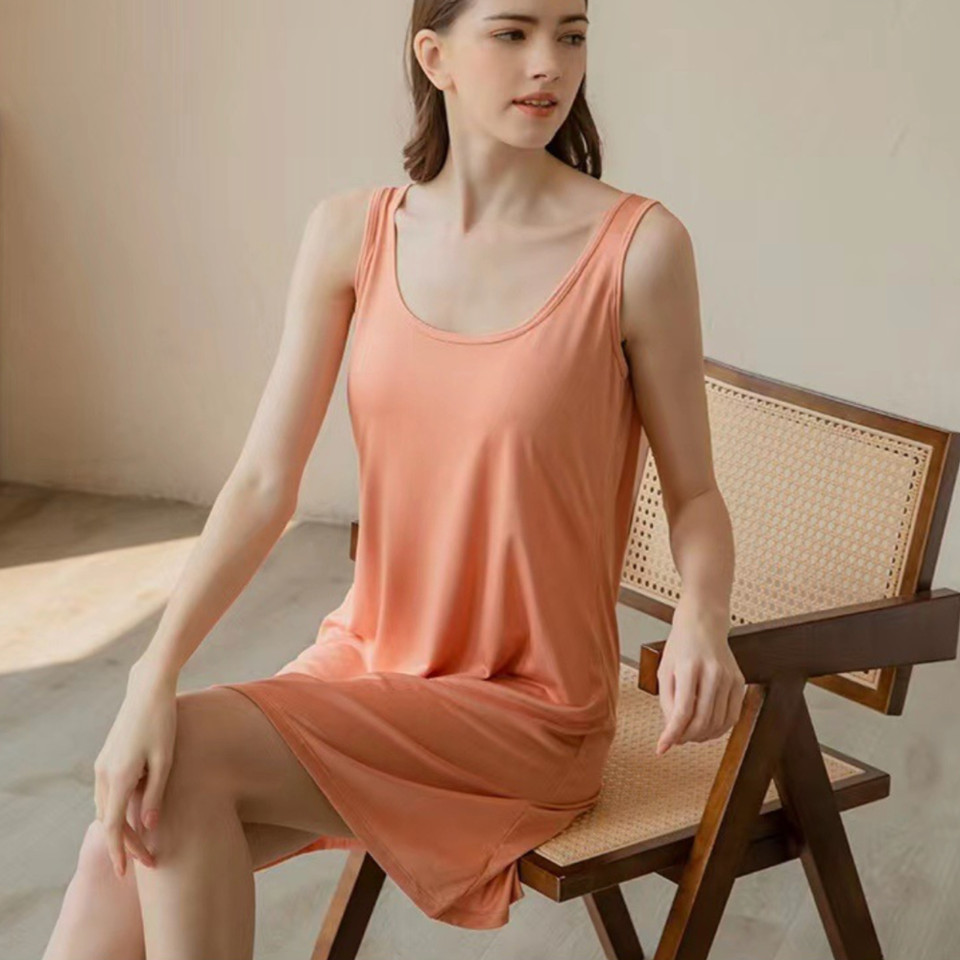 Woman wearing orange Essential modal sleeveless lounge dress with built-in bra