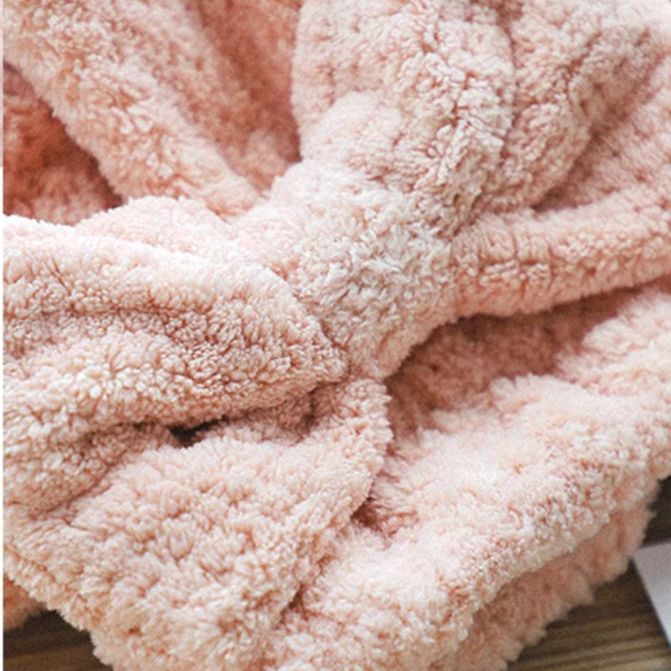Close-up of the bow detail on the mauve pink hair towel