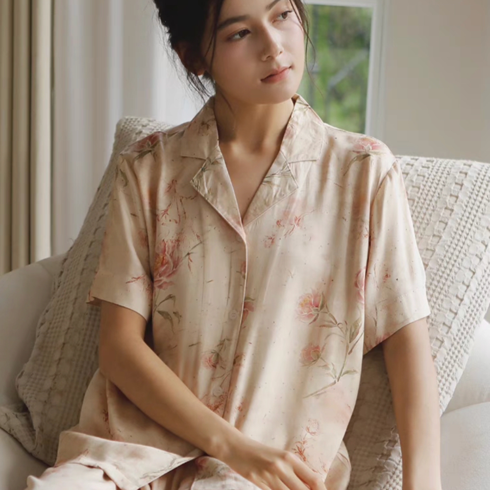 Woman seated in rose garden viscose pajama set