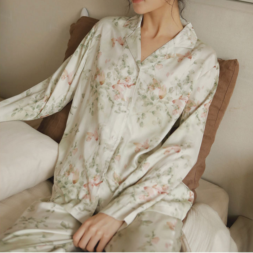 Close view of the Green Still Bloom floral pajama set with button-front top and notched collar