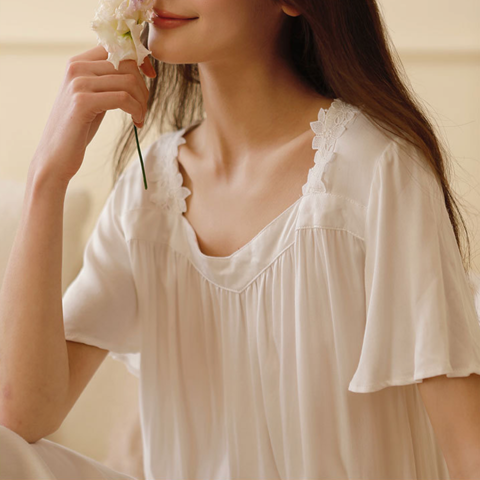 Flutter sleeve and flowing drape detail of maxi nightgown