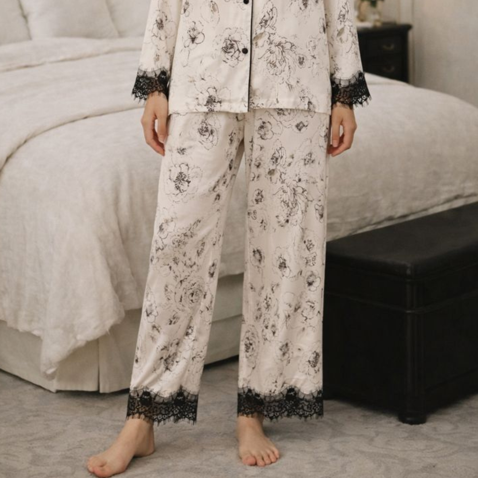 Detail view of the black lace trim and ink floral print on Ink Garden pajamas