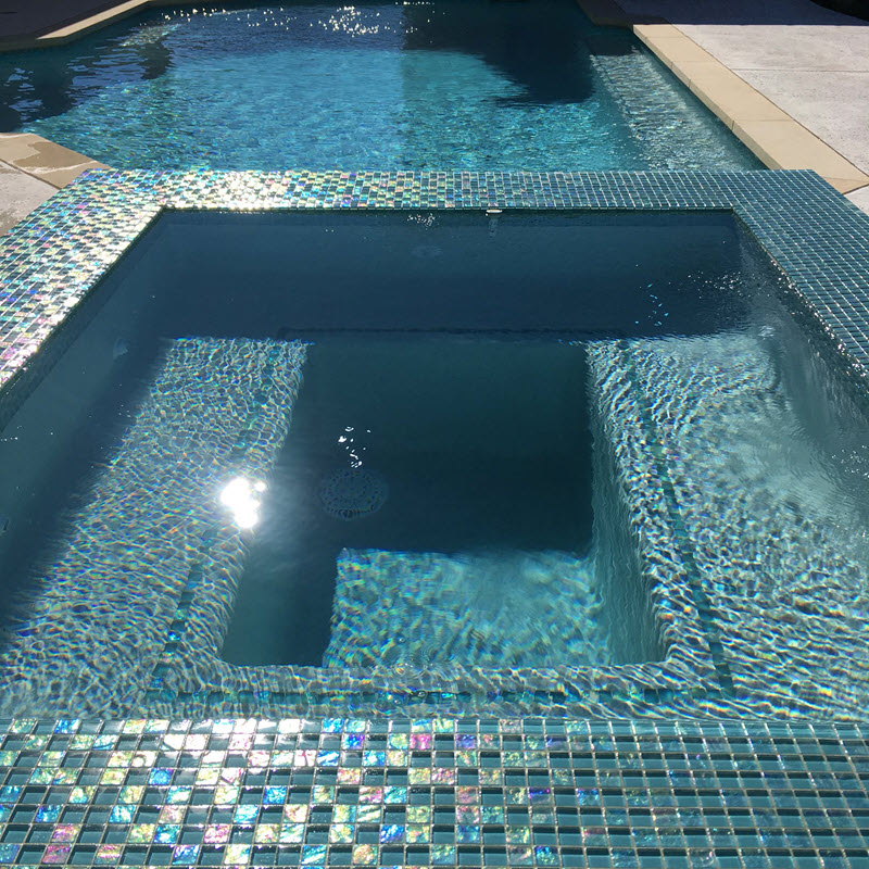 Add shimmer to your pool with glass mosaics