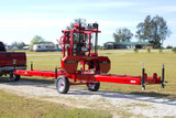 MP-32 Sawmill in stock and portable. manual sawmill being hauled by a sawyer