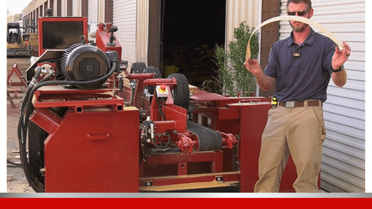 Operator using PR6 pallet resaw with dual cutting heads, high output pallet bandsaw machine increasing yield and reducing waste in lumber processing facility