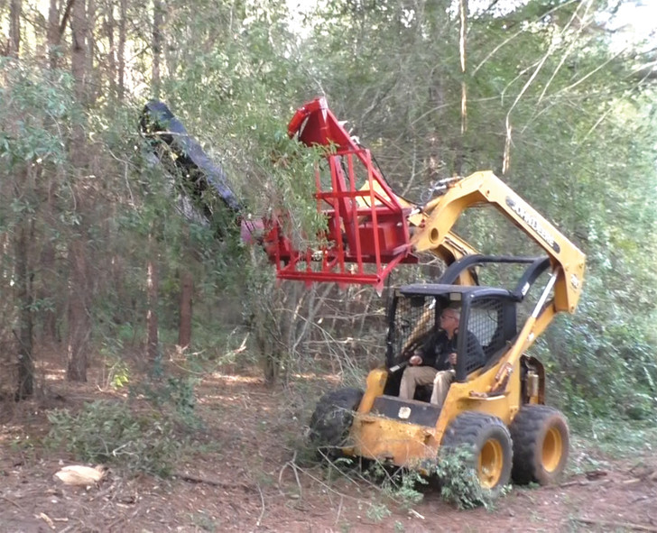 Trailblazer sawing tree limbs