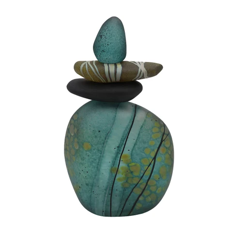Back view of blown glass cairn sculpture by Melanie Leppla with three glass stones stacked on top of a teal base