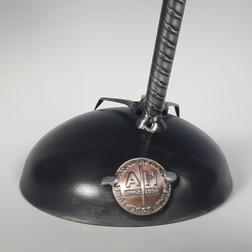 adam homan logo on funky bird sculpture