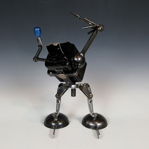 Sculpture of a vintage camera taking a selfie by Adam Homan