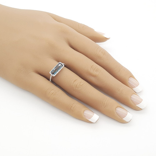 White gold ring with diamonds and London blue topaz bar by Doves on hand