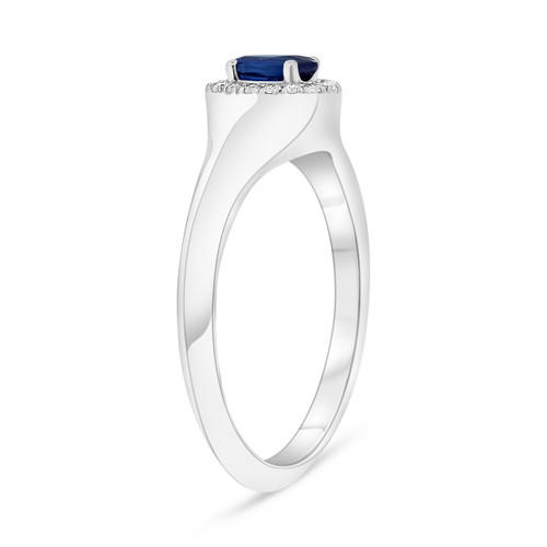 White gold ring with diamonds and sapphire by Roman and Jules