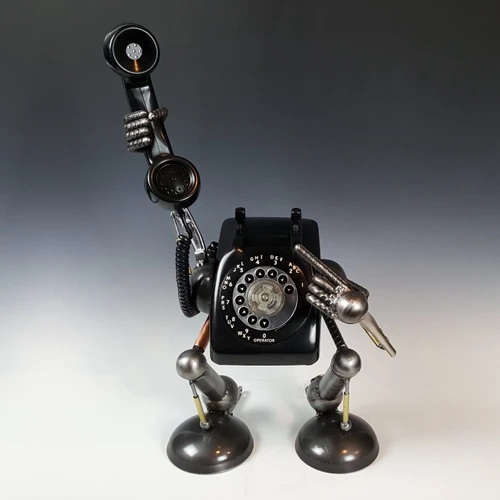 It's for You robot sculpture holding up a rotary phone handset, steel and vintage phone by Adam Homan
