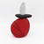 Back view of blown glass cairn sculpture by Melanie Leppla with two glass stones stacked on top of a red base