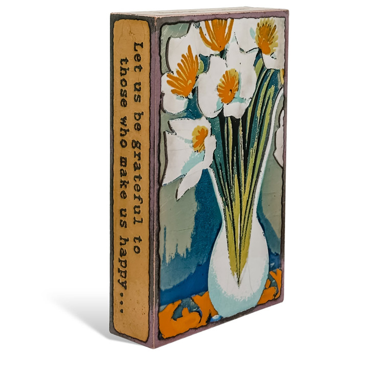 small wall or desk art with a white vase and white flowers.  Left side view. small wall or desk art with a white vase and white flowers.  Left side view.