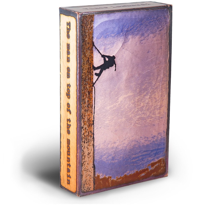 silhouette of man climbing