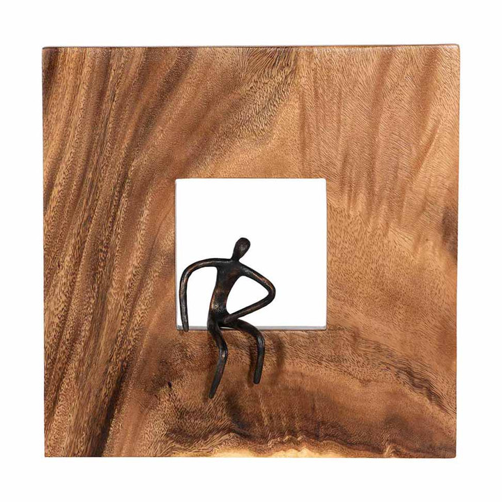 square wood tile with small metal man