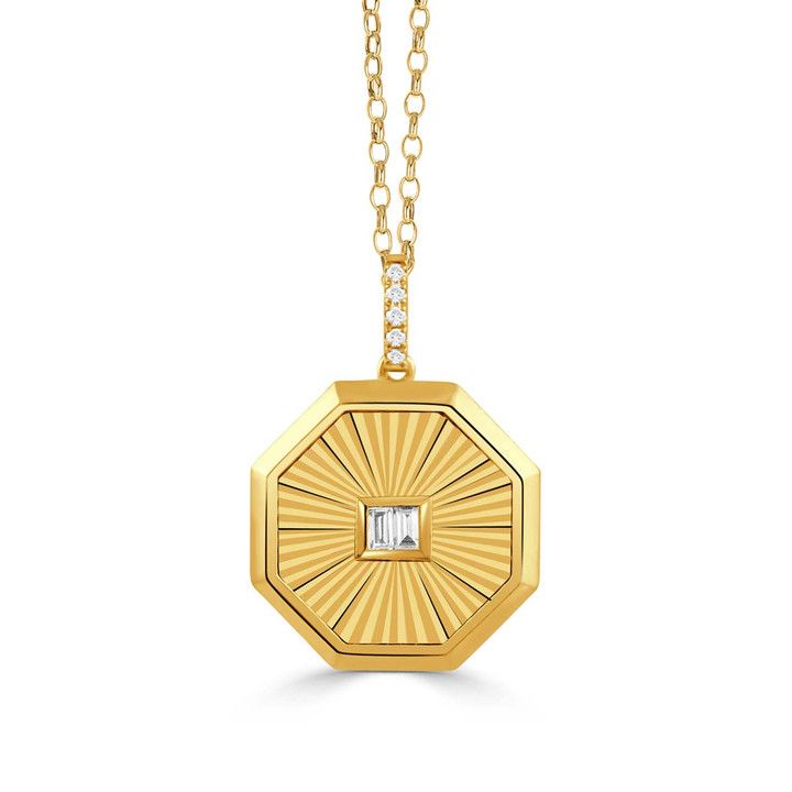 eight sided textured gold pendant with diamond center