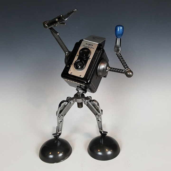 Sculpture of a vintage camera taking a selfie by Adam Homan