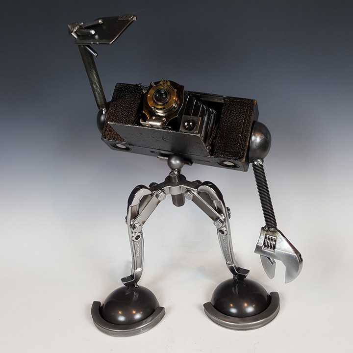 Sculpture of a vintage camera taking a selfie by Adam Homan