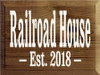 9x12 Walnut Stain board with White text Wood Sign
Railroad House
Est. 2018