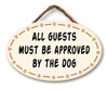All Guests Must Be Approved By The Dog - Funny Round Hanging Sign 8x5in.