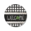 Welcome with green four leaf clover and black and white plaid design on circle sign