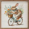 Bunny rabbit riding a bicycle with colorful spring flowers on Wood Framed Sign