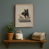 Adorable Black Cat Sitting On A Pile Of Folded Laundry on Wood Framed Art Print for Laundry Room Decor