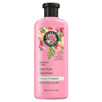 A 13.5 fl oz Herbal Essences Rose Hips Smooth Conditioner bottle with a vibrant design, featuring nourishing rose hips, vitamin E, and jojoba extracts for soft, silky hair and a luxurious floral scent.