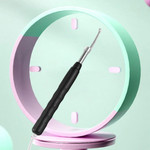 A sleek black ear wax removal device equipped with an HD camera and luminous endoscope, accompanied by soft, replaceable ear-picking scoops, showcasing its modern design and functionality.​
