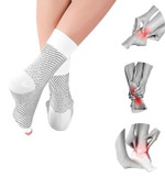 A pair of black ankle compression socks designed to provide support and alleviate foot and ankle swelling. These unisex socks feature targeted arch support and are made from a breathable, stretchy material, ensuring comfort for both men and women. A pair of black ankle compression socks designed to provide support and alleviate foot and ankle swelling. These unisex socks feature targeted arch support and are made from a breathable, stretchy material, ensuring comfort for both men and women.