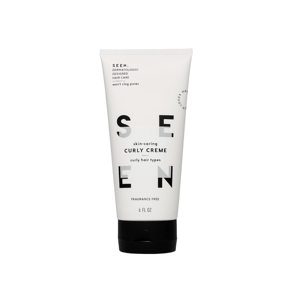 A sleek tube labeled "SEEN Curly Creme, Fragrance Free" with a smooth, creamy texture, ideal for defining curls and reducing frizz.​