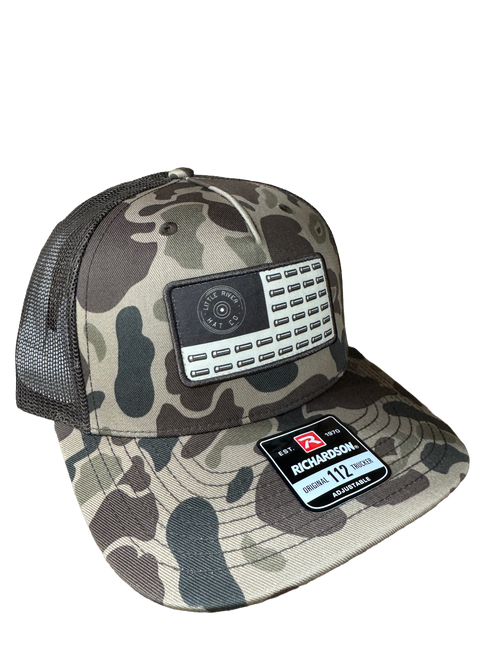 Shop the Shotgun Patch 258 Rope Hat featuring a custom shotgun shell patch, braided rope detail, and Richardson 258 fit. A bold, modern take on classic field-style headwear.