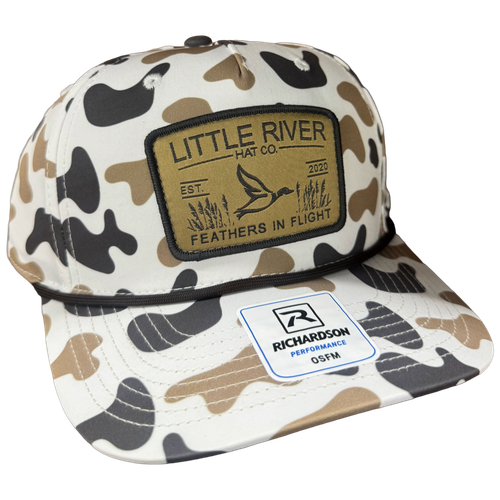 Little River Feathers in Flight 258 hat with camo pattern, braided rope detail, and woven flying bird patch.