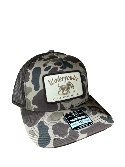 WaterFowler 112 trucker hat in Bark Duck Camo with dog retrieving bird patch and mesh back