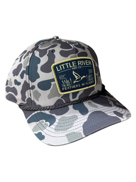 Little River Feathers in Flight 258 hat with camo pattern, braided rope detail, and woven flying bird patch.