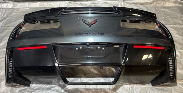 2015-2019 Chevrolet C7 Corvette Z06 Grand Sport Rear Bumper Cover w/ Spoiler / Watkins Glen Gray Metallic *DAMAGE* C7008