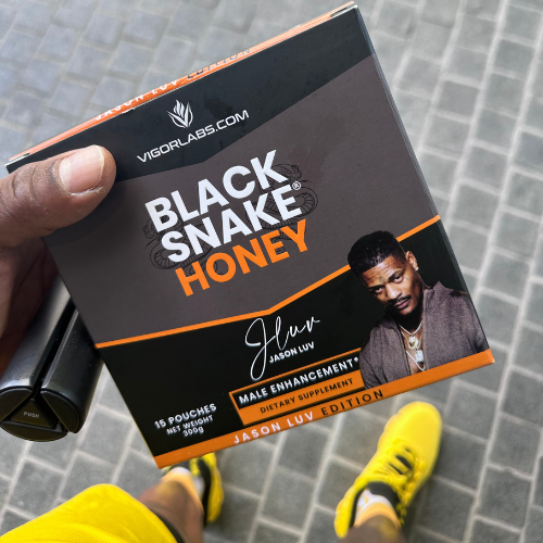 Man holding box of Black Snake Honey