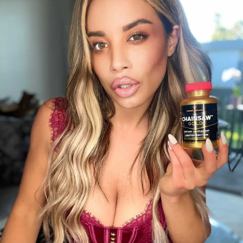 Woman holding bottle of Chainsaw Gold