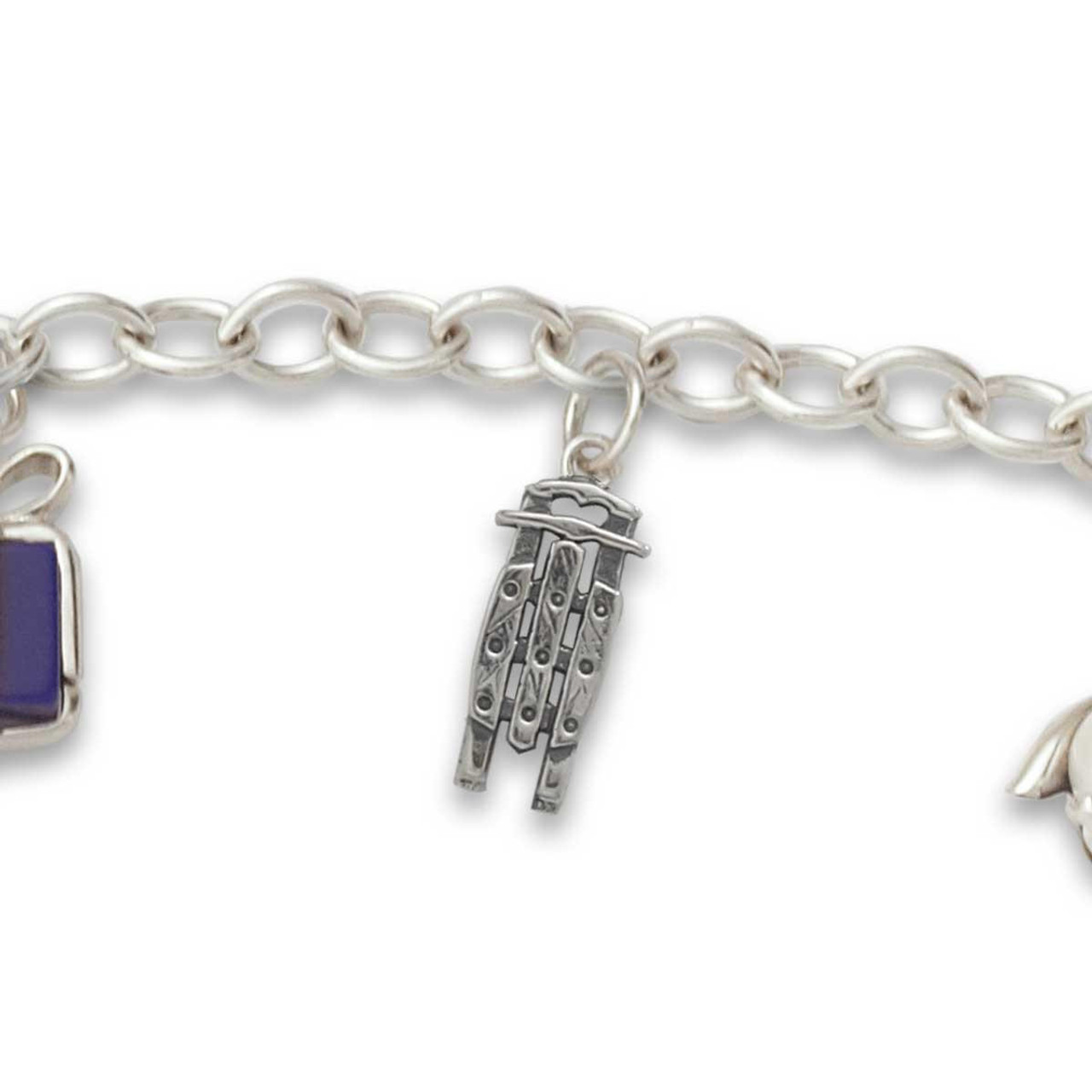 Check out our clever Sterling Silver Charm Bracelet - J.H. Breakell and Co.